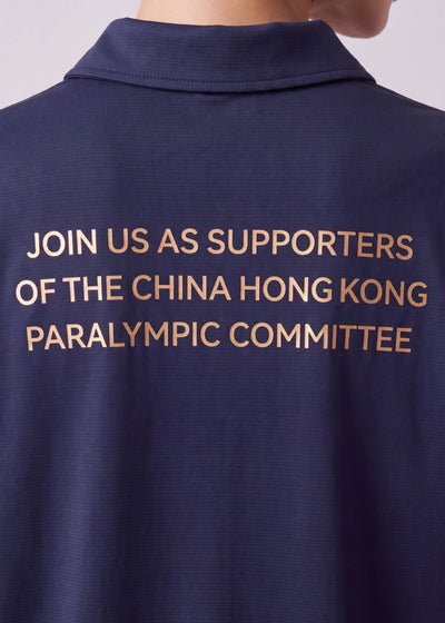 Back view of the navy blue polo shirt featuring gold text that reads 'JOIN US AS SUPPORTERS OF THE CHINA HONG KONG PARALYMPIC COMMITTEE'.