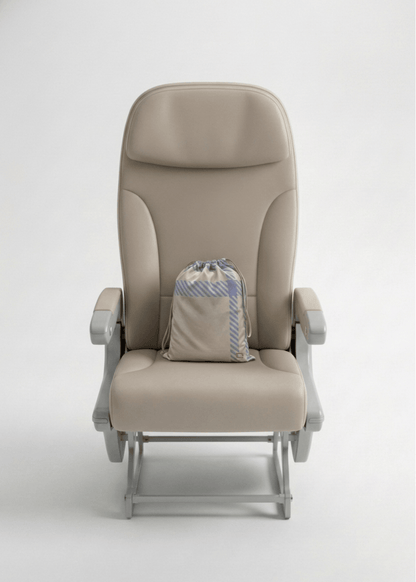 A travel set resting on a seat.